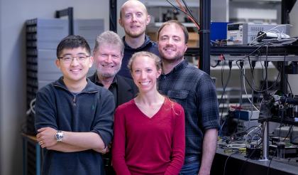 Mikkel Heuck, Andrew Golter, Genevieve Clark, Mark Dong, and Gerry Gilbert in MITRE's Quantum Lab