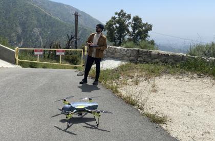 Dhanuj working with a drone