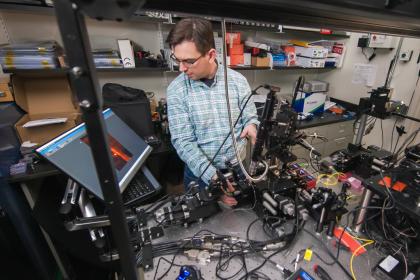 MITRE employee working in the quantum lab