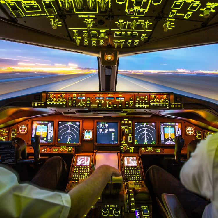 Pilots In the cockpit of plane during take-off