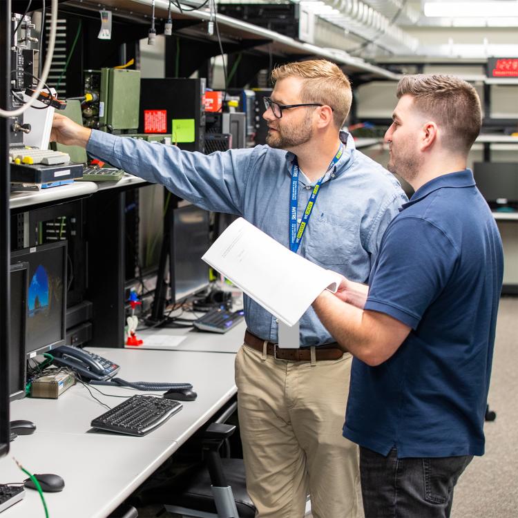 MITRE employees working in the E building lab