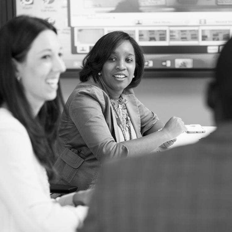 Employees collaborating in a lab