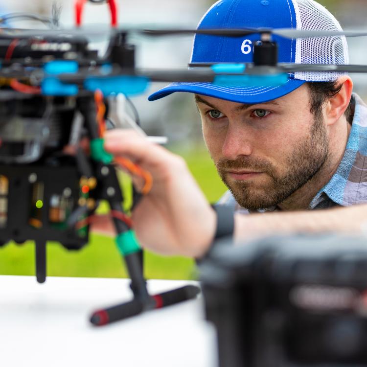 Employee holding a drone