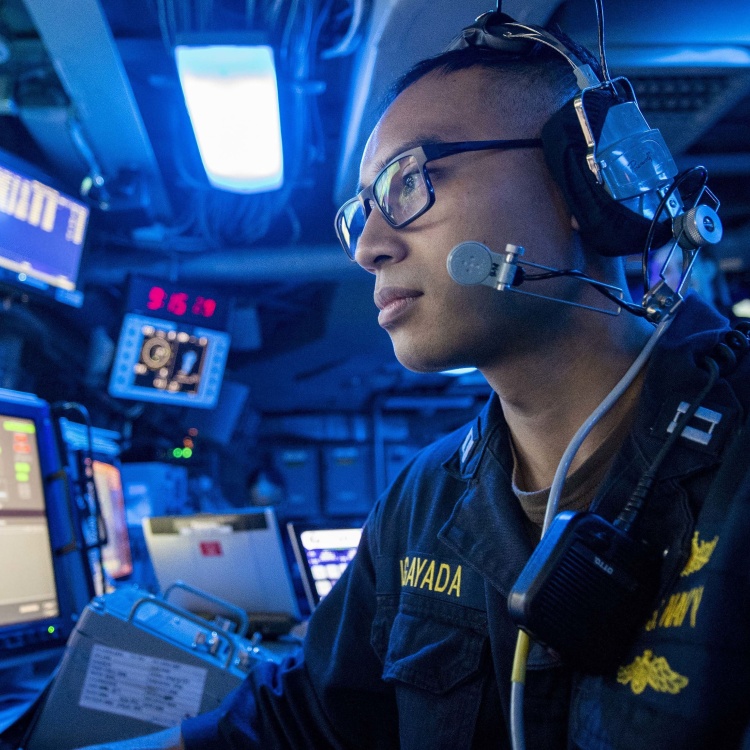 Navy Lt. works in the command center aboard the USS John P. Murtha